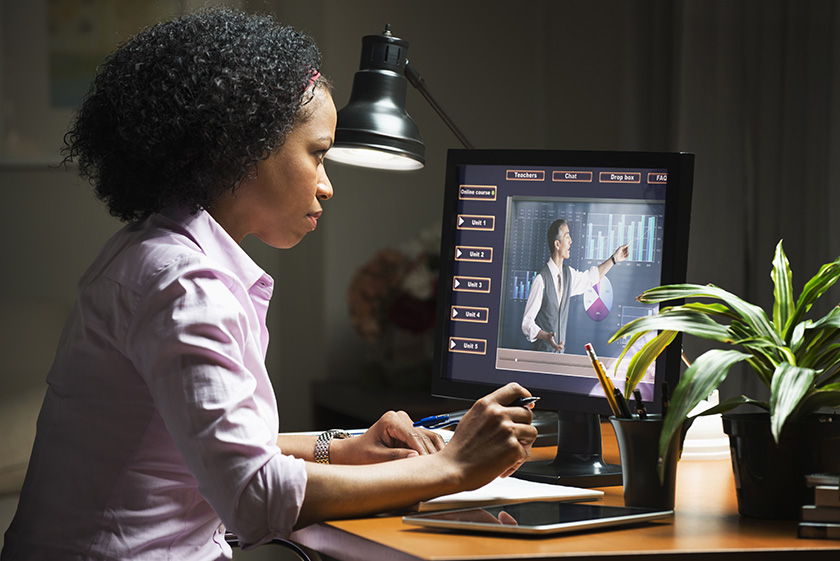 633710077 Woman taking online class on computer